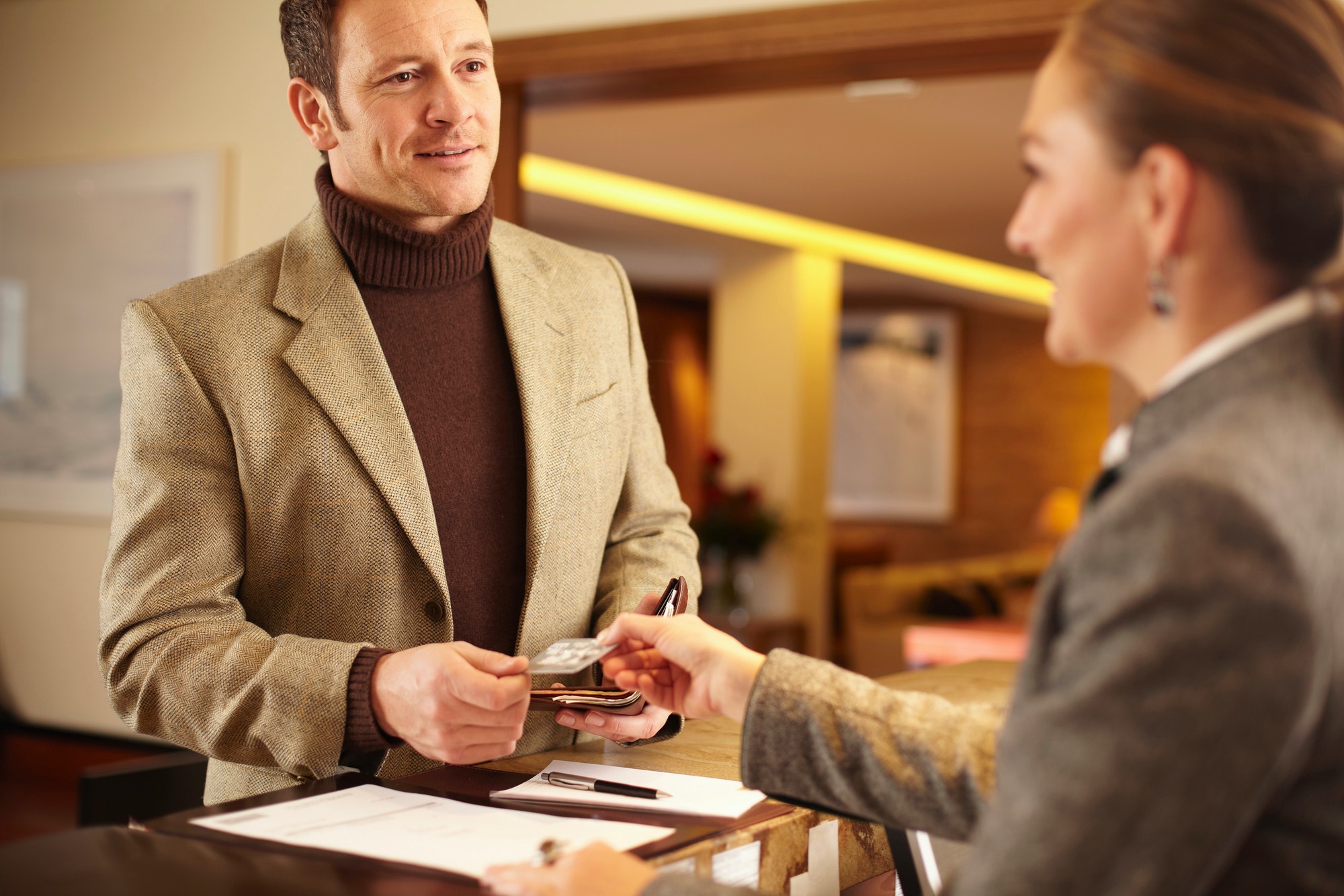 Man checking in to hotel